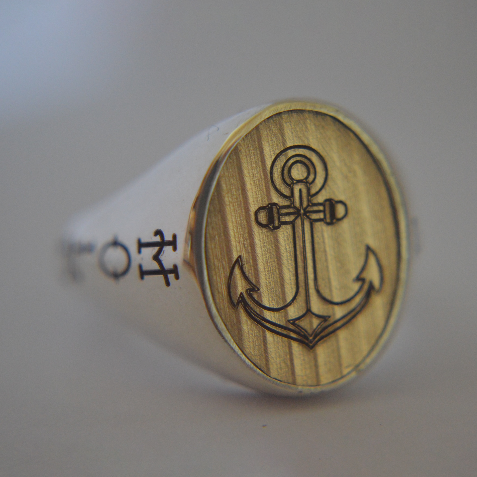Silver ring with anchor design